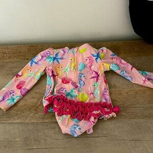 Posh Peanut coral seahorse one piece with rash guard